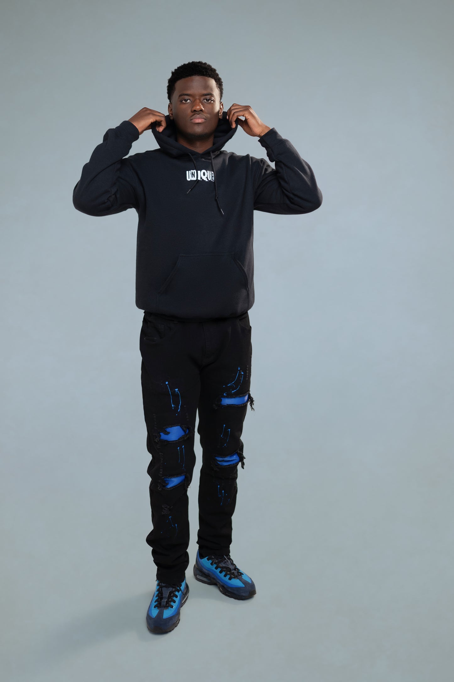 Black listed unisex mid-weight unisex hoodie. Classic fit